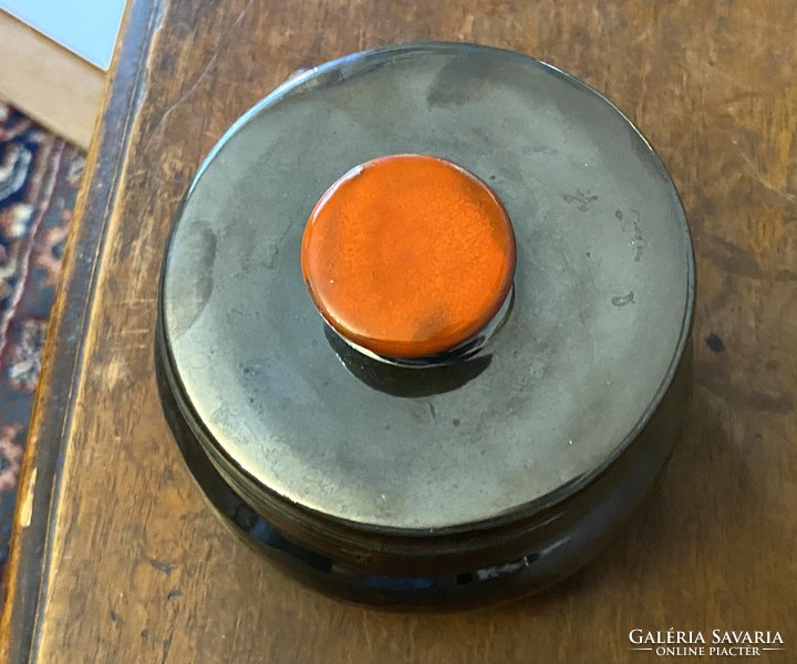 Gray round ceramic lidded jewelry holder bowl with orange tongs