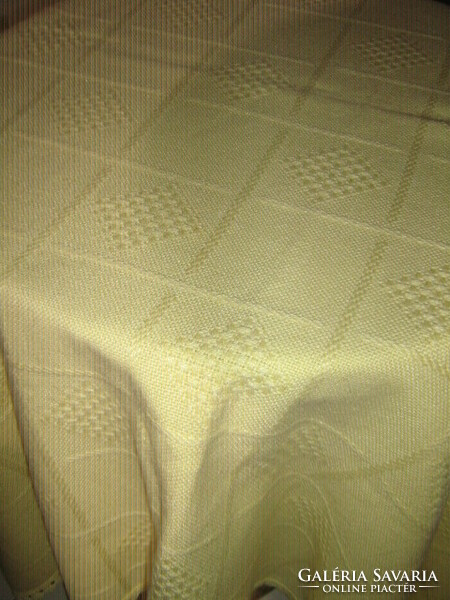 Woven tablecloth with a beautiful yellow lacy edge