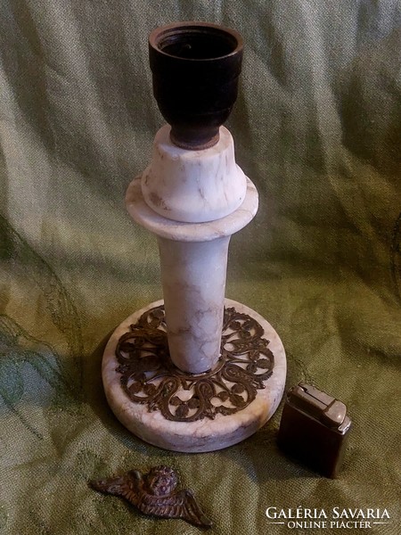 Marble lamp, self-lighter with gamma inscription, and putto head for sale together