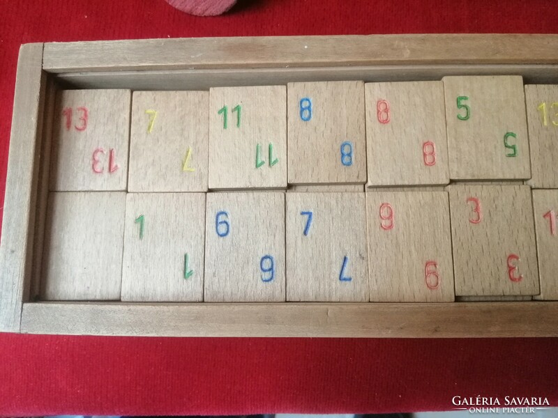 Old board rummy in a wooden box with wooden cards