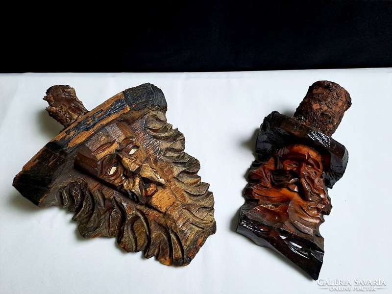 2 antique, hand-carved wooden human heads from a block that can be hung on the wall, relief