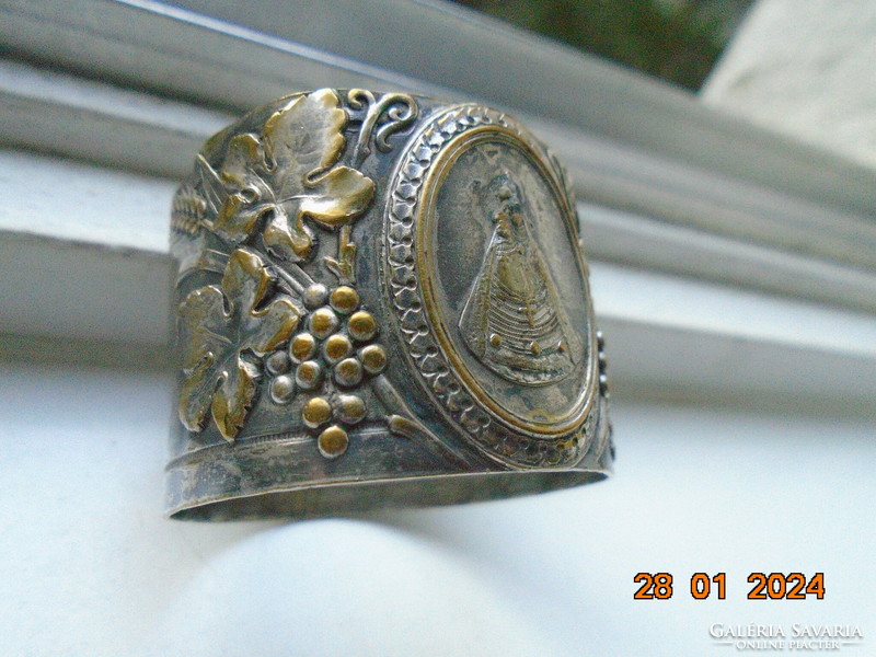Répoussé silver-plated copper napkin ring with Mary baby Jesus and rich grape decoration