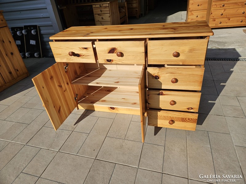 Three-door, three-drawer pine dresser in good condition for sale.
