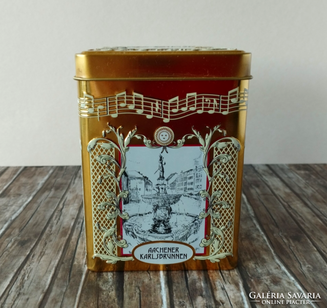 A beautiful gold-colored German tin music box