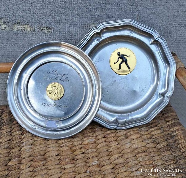 2 pewter bowls with sports medals.