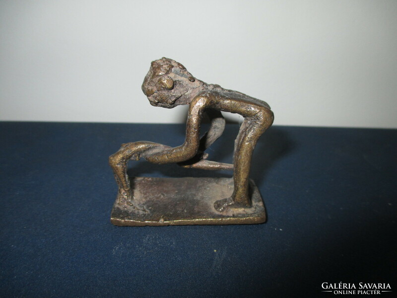 A small amorphous bronze statue