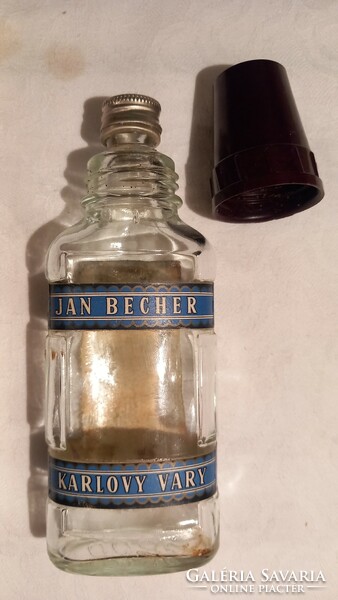 Small becherovka bottle with an old vinyl cap