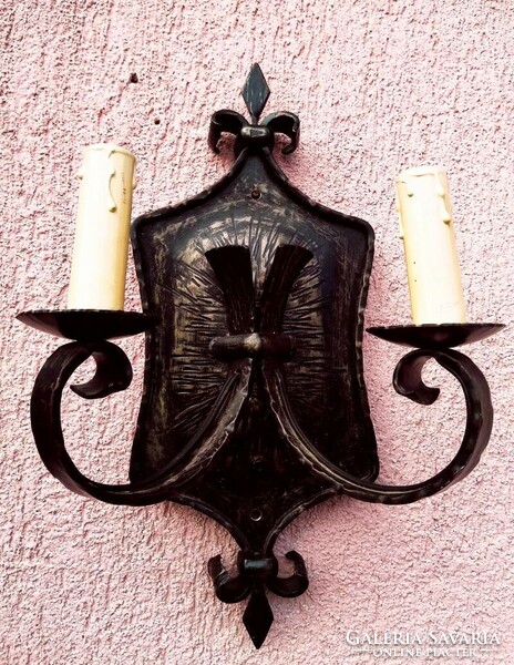 Antique wrought iron two-arm wall lamp. Into a collection of handcrafted artefacts