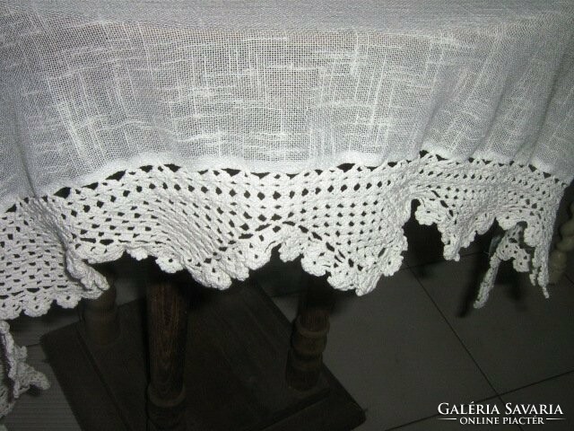 A beautiful pair of curtains with hand-crocheted edges