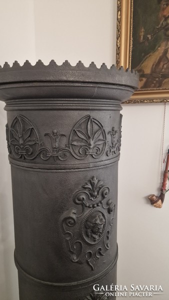 Cast iron column stove. 170 cm high