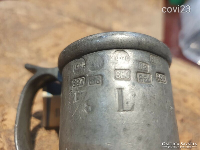 Antique pewter cup with a bunch of authentication marks from the 1890s
