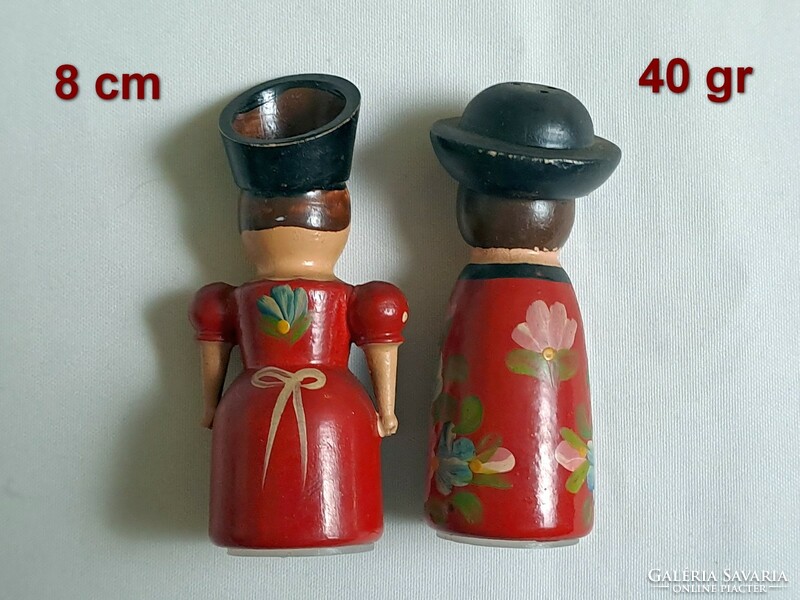 A pair of wooden salt and pepper shaker figurines, hand-painted with a Kalocsa pattern