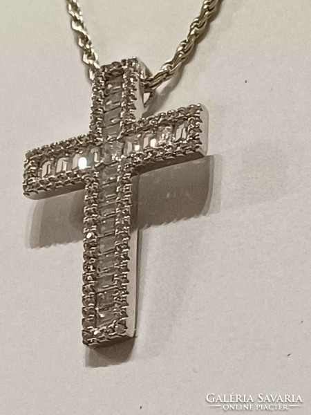 A beautiful silver chain with a large silver cross