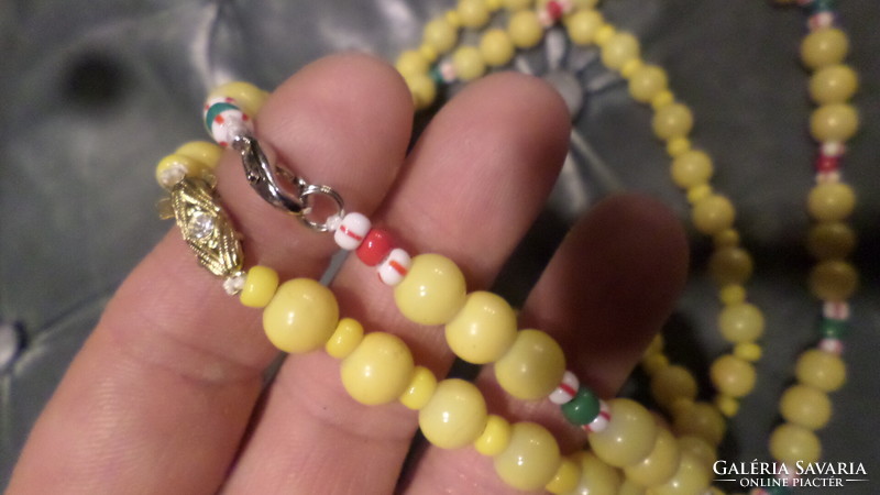 2 Pcs (52 and 45 cm) retro necklaces made of yellow glass beads, together.