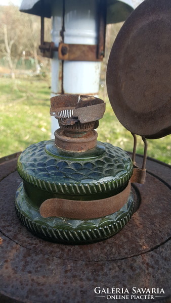 Old kerosene lamp with a rare green glass container