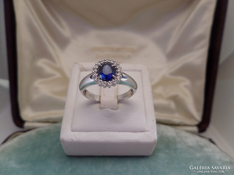 White gold ring with beautiful colored blue sapphires and brilliants