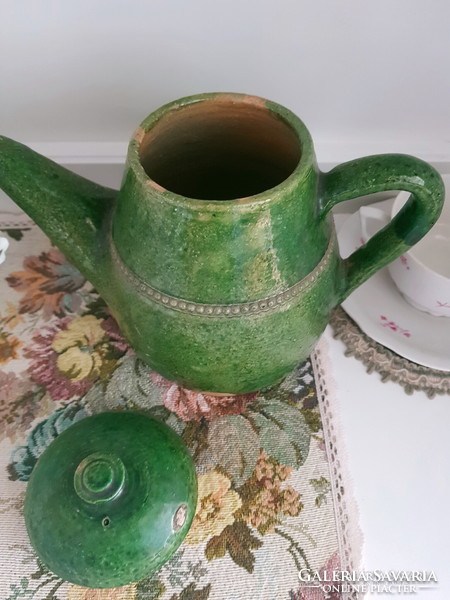 Antique ceramic jug with lid