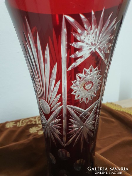 Ruby-burgundy polished crystal vase.