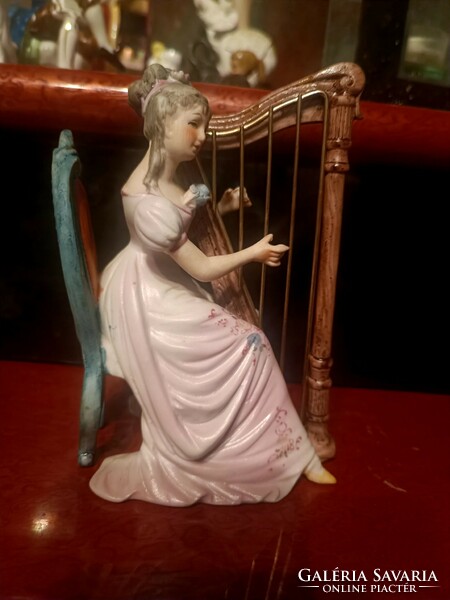 Harp playing lady