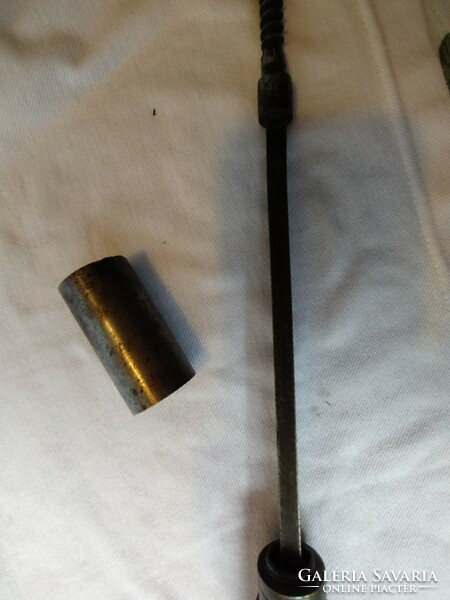 Old solid metal with graduated drill stick inside