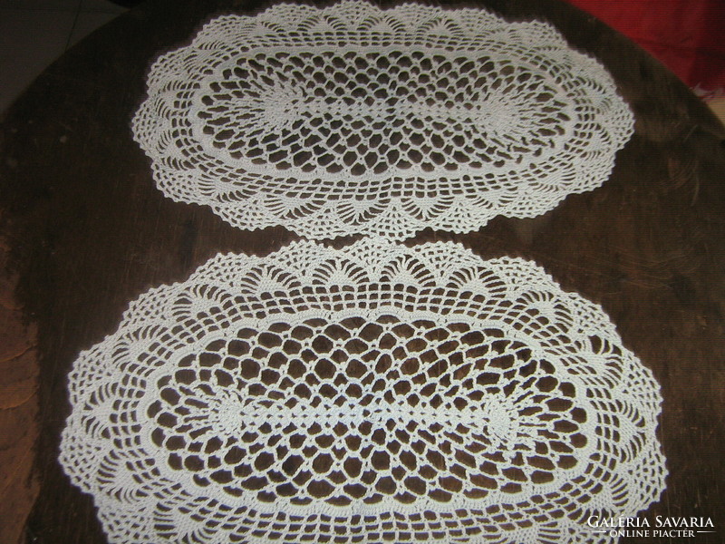 Cute hand crocheted oval light blue tablecloth in a pair