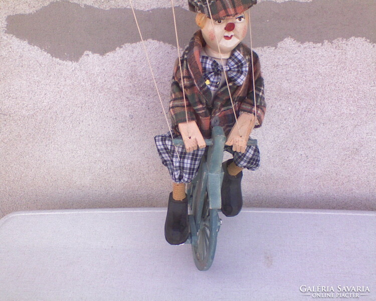 Cyclist clown puppet figure