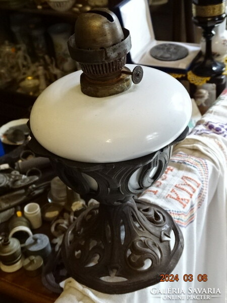 Antique table kerosene lamp in an Art Nouveau openwork iron basket