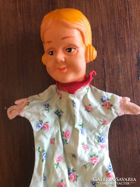 Old, antique, toy little girl doll figure. Rubber glove puppet, hand puppet. The head is completely intact, in good condition.