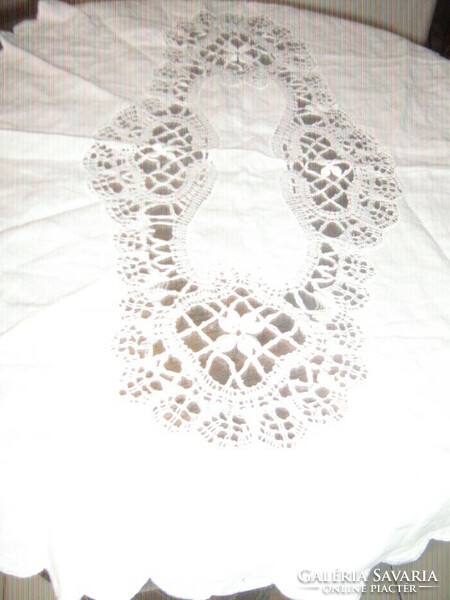 Beautiful stitched lace tablecloth or button-on pillow decoration
