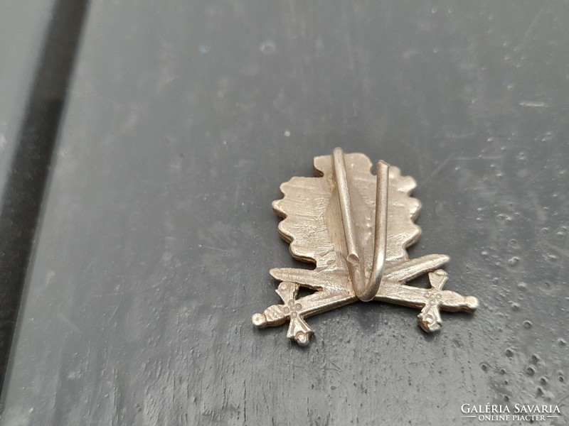 Some sort of sword military insignia or badge