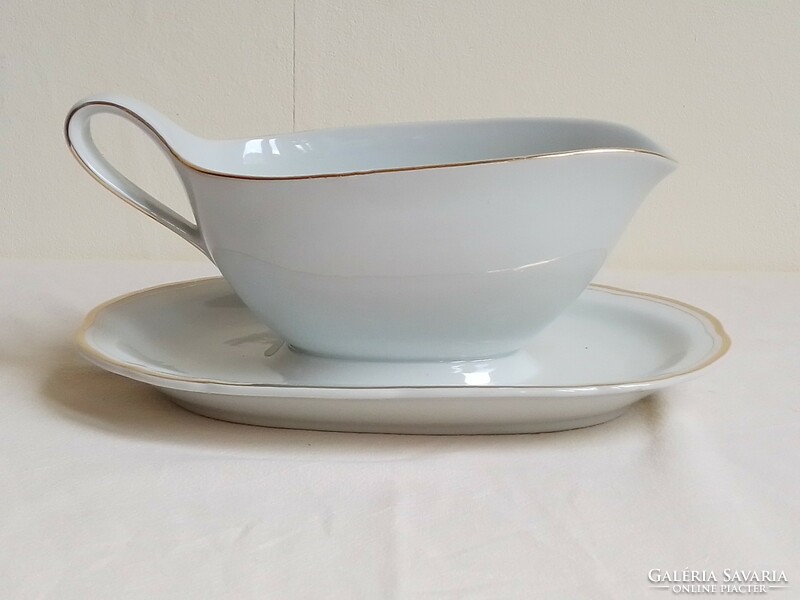 Old gold rimmed white glazed German porcelain sauce bowl with sauce pouring saucer