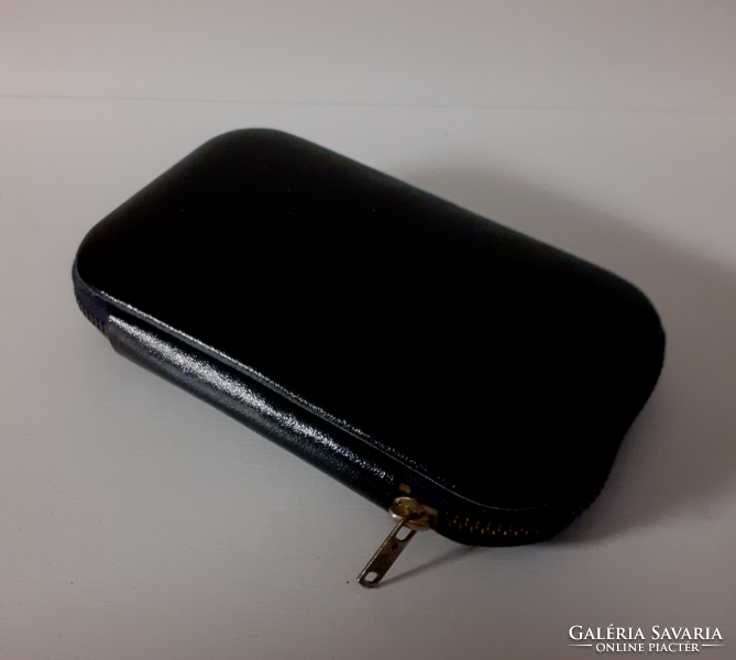 Old manicure set in beautiful condition in a black leather case