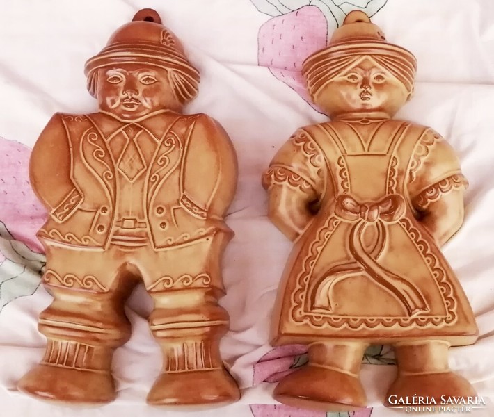 Ceramic gingerbread cookie cutter with a pair of male and female figures. Rare pieces of folk art