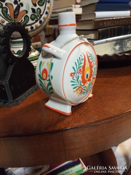 Drasche porcelain water bottle with folk art pattern, diameter 9 cm. I keep it in a display case.
