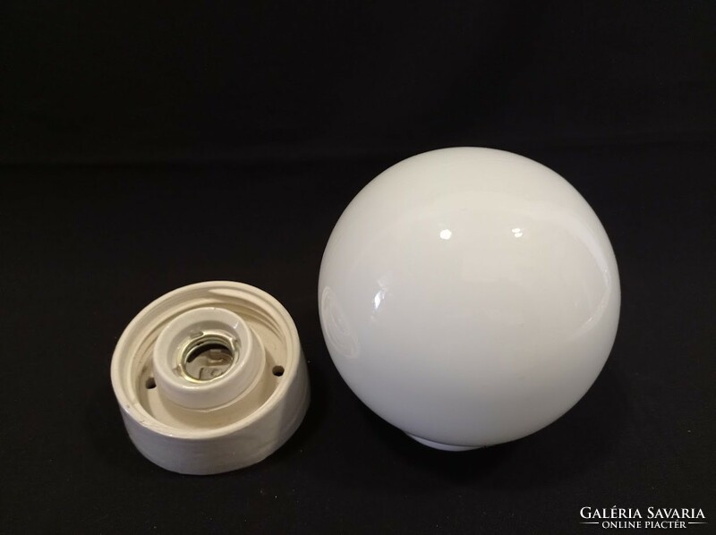 Old porcelain socket wall lamp with glass sphere cover