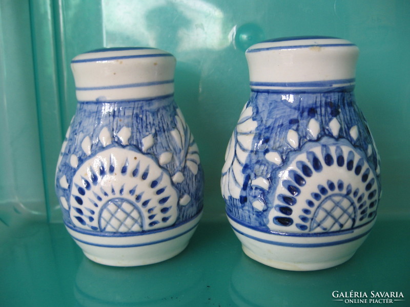 Pair of blue and white ceramic salt and pepper shakers and table spice holders