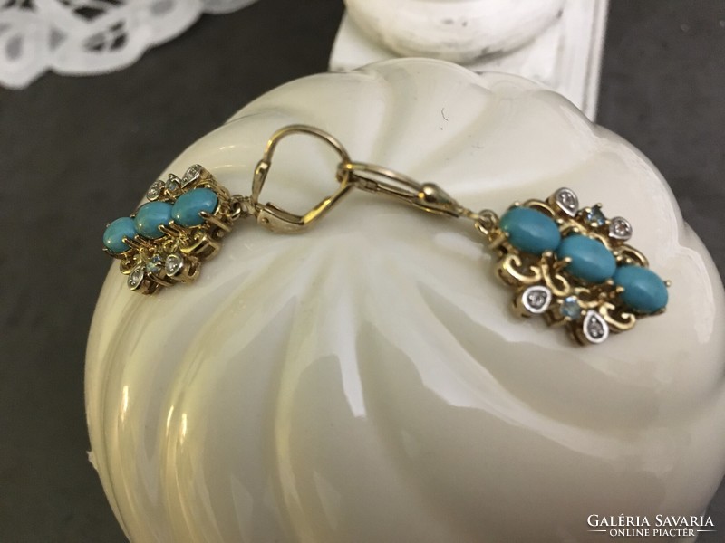 Beautiful, unique silver earrings with turquoise and topaz stones, run with gold