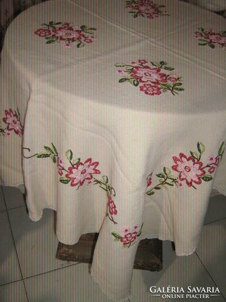 Beautiful antique hand embroidered tablecloth with lacy edges
