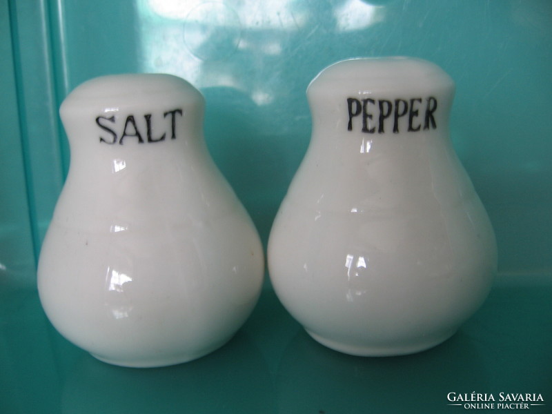 Pair of white porcelain salt, pepper shakers and table spice holders