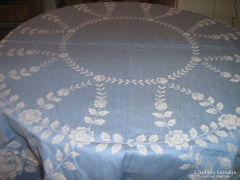 Beautiful vintage blue damask tablecloth with white flowers