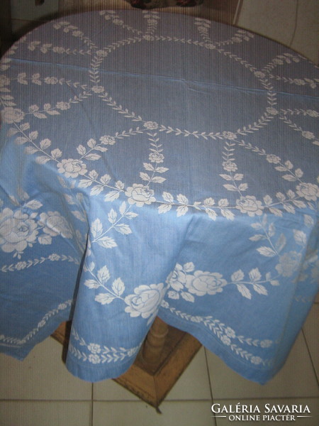 Beautiful vintage blue damask tablecloth with white flowers
