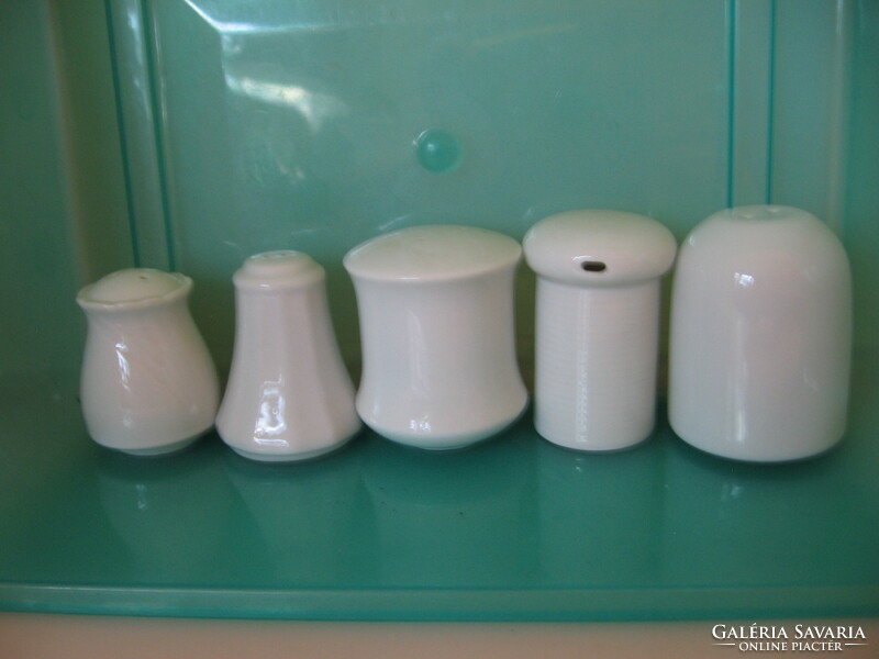 White salt shakers in pieces