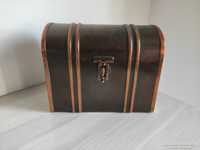 Red copper alloy drums lined with brown velvet in the shape of a traveling chest