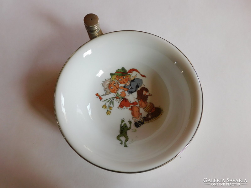 Old porcelain children's plate with stainless steel container that keeps it warm