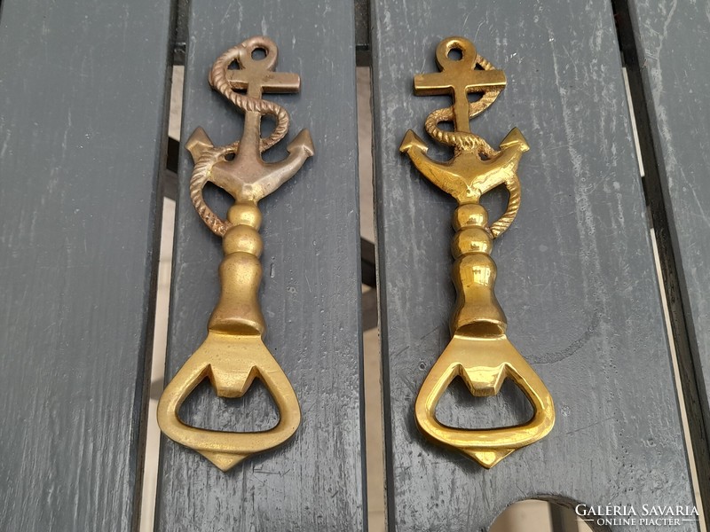 A pair of beautiful solid copper beer openers