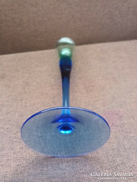 Beautiful graceful thin glass vase with a blue-green transition