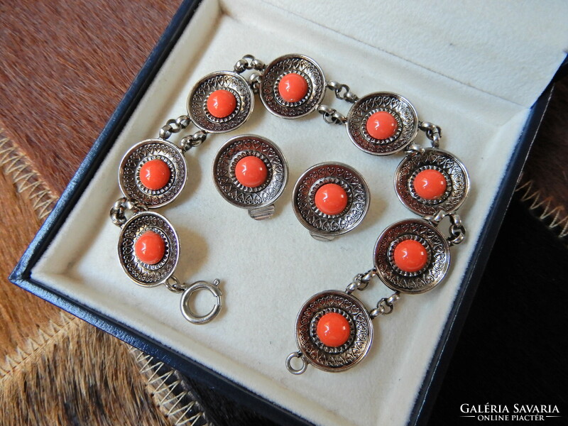 Old metal jewelry set with coral colored stones