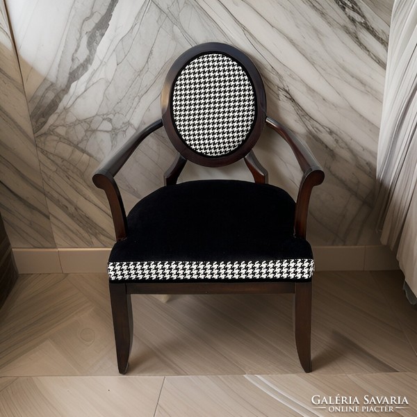 Design armchair with houndstooth pattern upholstery