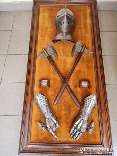 Antique late 19th century historicizing hatchets with armored helmet and gloves on tableau