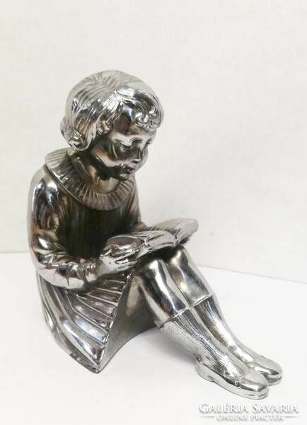 Reading girl. A pewter statue with a silver-plated surface. A unique rarity